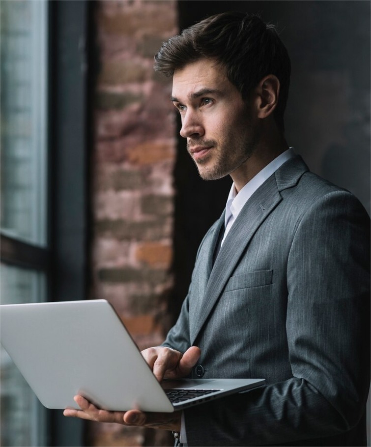 a man works at a laptop